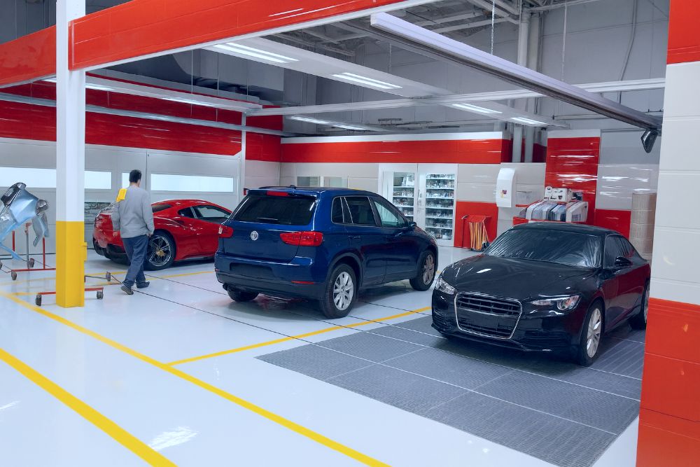 Body-shop-filled-with-luxury-cars-after-getting-a-drp-with-Top-Shop